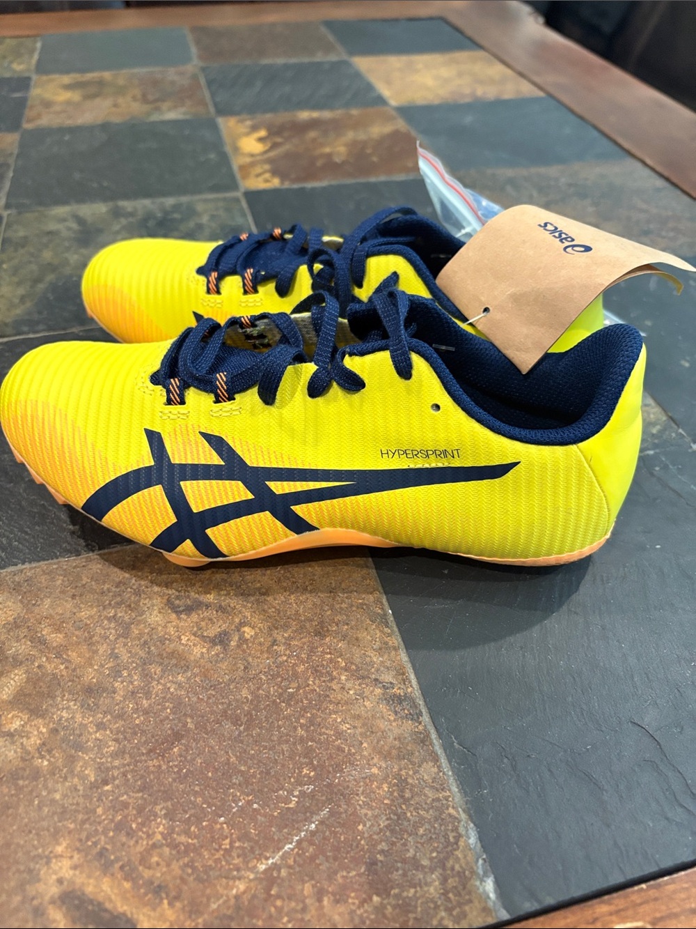 NWT ASICS unisex Yellow and Navy Hypersprint Track Sneakers. Size 5.